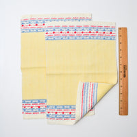 Yellow Napkins with Red, Blue, + White Border - 10" x 14"